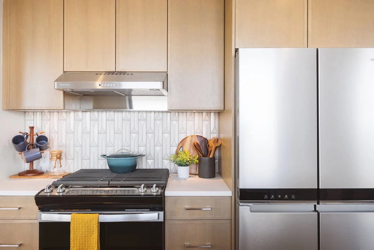 Detroit apartments for rent - image - Two bedroom penthouse kitchen with a stove and a refrigerator