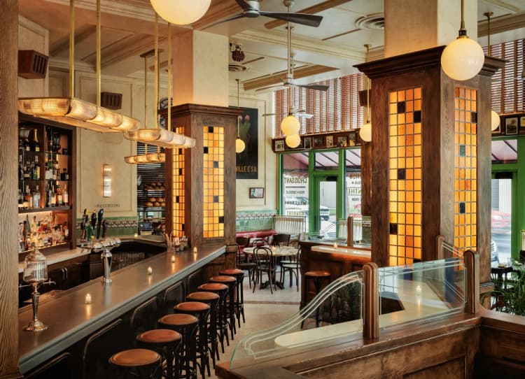 Detroit apartments for rent - image - a bar in a restaurant with wooden pillars and chairs