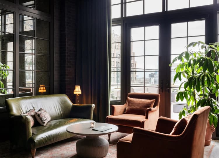 Detroit apartments for rent - image - a living room filled with furniture and large windows