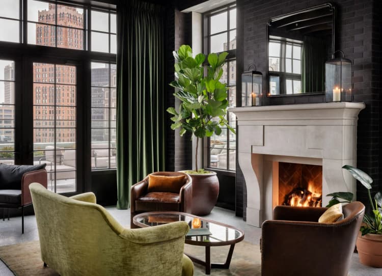 Detroit apartments for rent - image - a living room with furniture and a fireplace and large windows