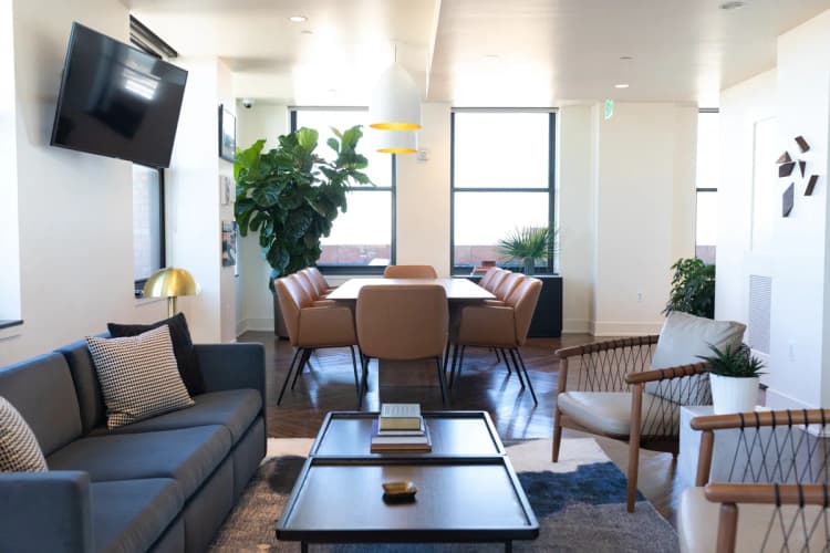 Detroit apartments for rent - image - Conference lounge area with a variety of seating and tables.