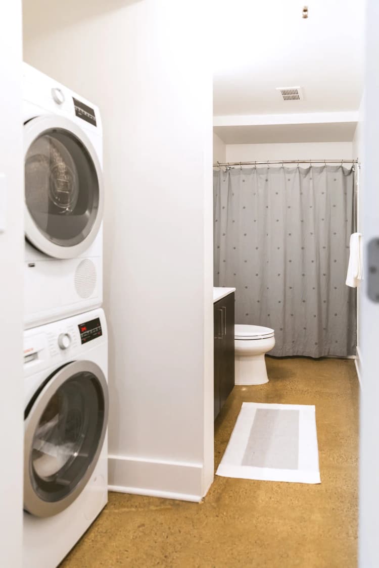 Detroit apartments for rent - image - a bathroom with a washer and dryer and a toilet