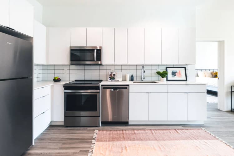 Detroit apartments for rent - image - 2665 Brush Kitchen with Stainless Steel Appliances, Quartz Countertops and Tile Backsplashes
