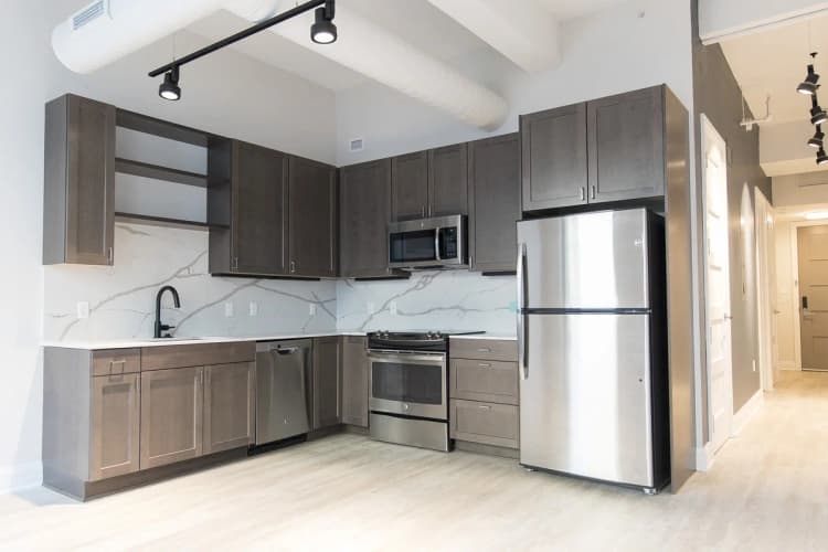 Detroit apartments for rent - image - Kitchen with hardwood floors and stainless steel appliances
