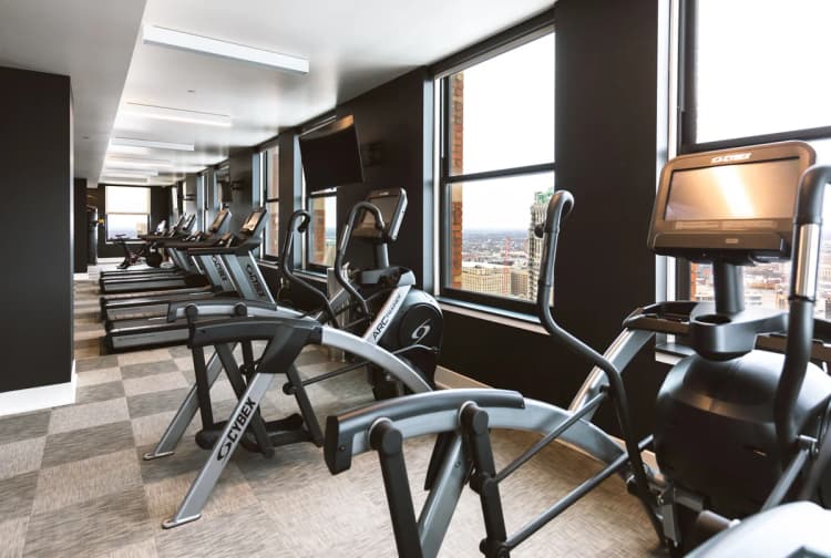 Detroit apartments for rent - image - The Stott fitness center with treadmills and elliptical machines.